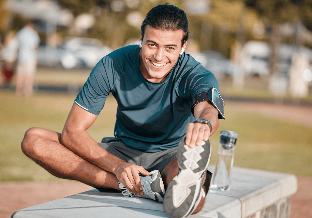 Man stretching before outdoor workout